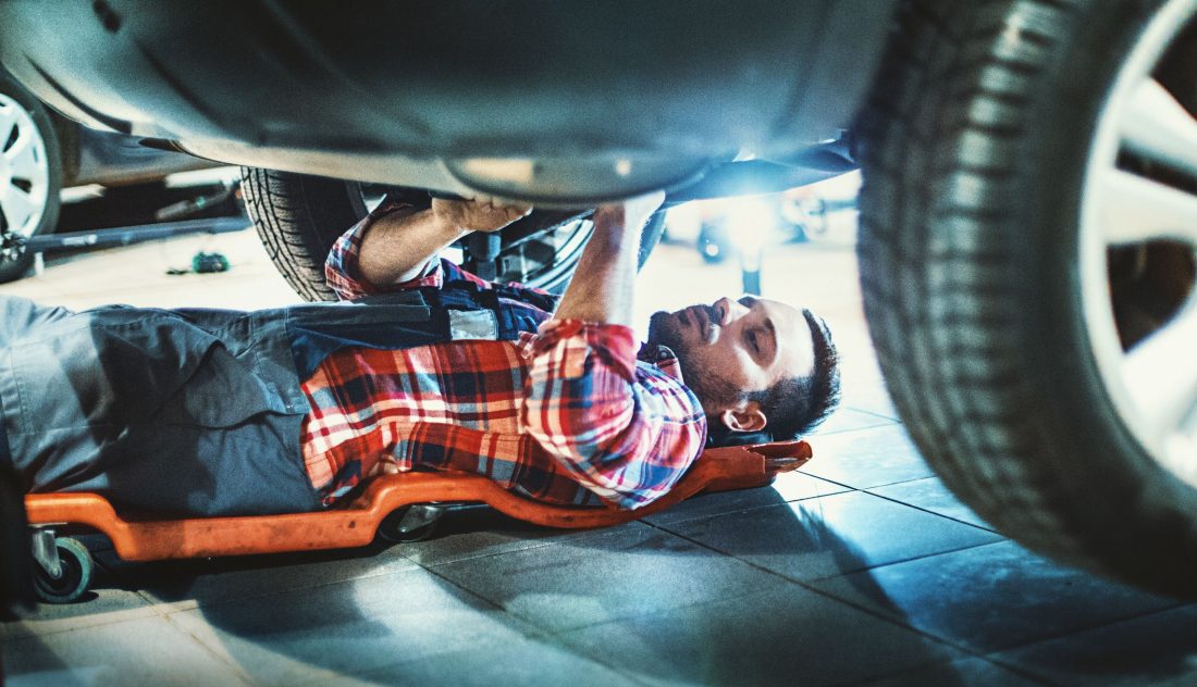 mechanic cheching for a hidden GPS tracker